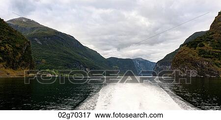 Wake in a Fjord made from a moving boat, Balestrand, Sognefjord, Norway View Large Photo Image Stock Photo - Wake in a Fjord made from a moving boat, Balestrand, Sognefjord, Norway. Fotosearch
