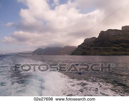 Wake of ship along Santorini shoreline View Large Photo Image Stock Photo - Wake of ship along Santorini shoreline. Fotosearch