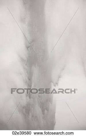 Waterfall over rocky cliffs in Iceland View Large Photo Image Stock Image - Waterfall over rocky cliffs in Iceland. Fotosearch