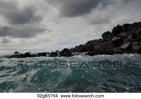 Waves breaking on the coast, Playa Ochoa, San Cristobal Island, Galapagos Islands, Ecuador View Large Photo Image Picture - Waves breaking on the coast, Playa Ochoa, San Cristobal Island, Galapagos Islands, Ecuador. Fotosearch