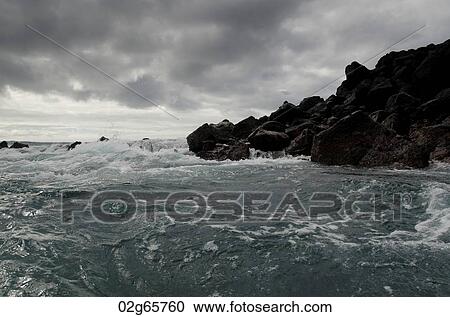 Waves breaking on the coast, Playa Ochoa, San Cristobal Island, Galapagos Islands, Ecuador View Large Photo Image Stock Image - Waves breaking on the coast, Playa Ochoa, San Cristobal Island, Galapagos Islands, Ecuador. Fotosearch