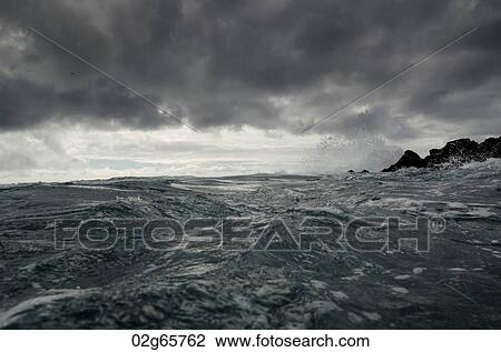 Waves breaking on the coast, Playa Ochoa, San Cristobal Island, Galapagos Islands, Ecuador View Large Photo Image Stock Image - Waves breaking on the coast, Playa Ochoa, San Cristobal Island, Galapagos Islands, Ecuador. Fotosearch