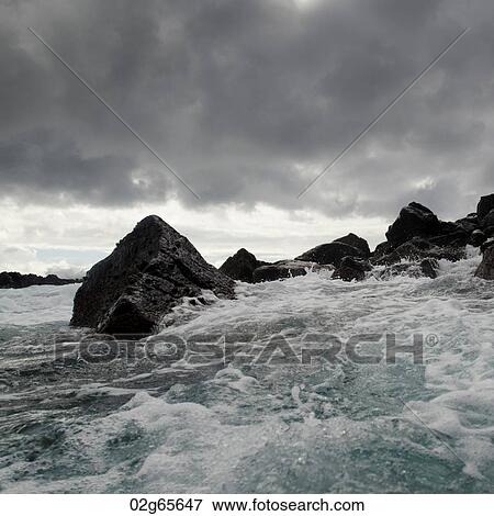 Stock Photo - Waves breaking on the coast, Playa Ochoa, San Cristobal Island, Galapagos Islands, Ecuador. Fotosearch