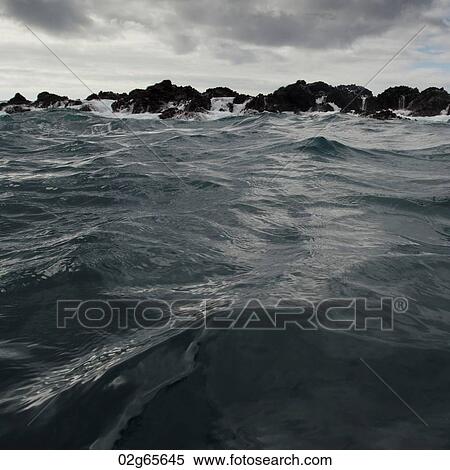 Waves breaking on the coast, Playa Ochoa, San Cristobal Island, Galapagos Islands, Ecuador View Large Photo Image Stock Photography - Waves breaking on the coast, Playa Ochoa, San Cristobal Island, Galapagos Islands, Ecuador. Fotosearch