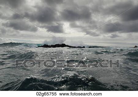 Waves breaking on the coast, Playa Ochoa, San Cristobal Island, Galapagos Islands, Ecuador View Large Photo Image Stock Photography - Waves breaking on the coast, Playa Ochoa, San Cristobal Island, Galapagos Islands, Ecuador. Fotosearch