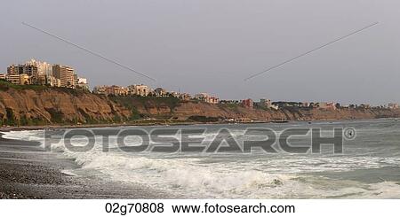 Waves with a city in the background, Miraflores District, Lima Province, Peru View Large Photo Image Stock Photo - Waves with a city in the background, Miraflores District, Lima Province, Peru. Fotosearch