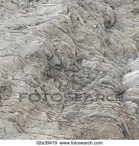 Wavy rock flake geological formation View Large Photo Image Stock Photo - Wavy rock flake geological formation. Fotosearch