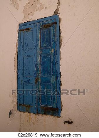 Weathered blue shutters in Mykonos Greece View Large Photo Image Stock Photo - Weathered blue shutters in Mykonos Greece. Fotosearch