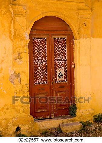 Weathered yellow wall in Rhodes Greece View Large Photo Image Stock Photo - Weathered yellow wall in Rhodes Greece. Fotosearch