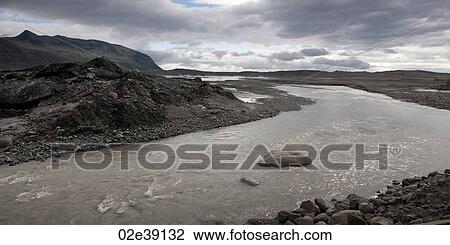 Stock Image - White water river running through rocky riverbed, . Fotosearch