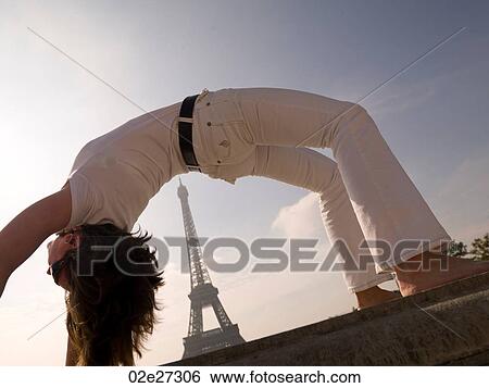 Stock Photograph - Woman doing yoga in Paris France. Fotosearch