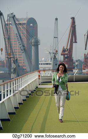 Woman in a cruise ship, Yangtze River, Shanghai, China View Large Photo Image Stock Image - Woman in a cruise ship, Yangtze River, Shanghai, China. Fotosearch