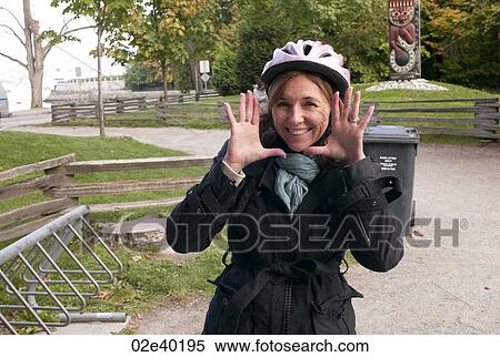 Woman making an expression with her face in Vancouver, British Columbia, Canada View Large Photo Image Stock Photography - Woman making an expression with her face in Vancouver, British Columbia, Canada. Fotosearch