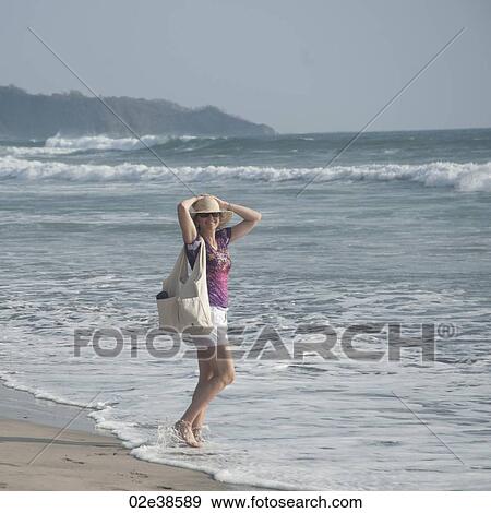 Woman on the Seashore in Costa Rica View Large Photo Image Stock Photo - Woman on the Seashore in Costa Rica. Fotosearch