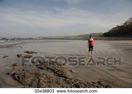 Woman walking on the beach, San Jose Costa Rica View Large Photo Image Stock Image - Woman walking on the beach, San Jose Costa Rica. Fotosearch