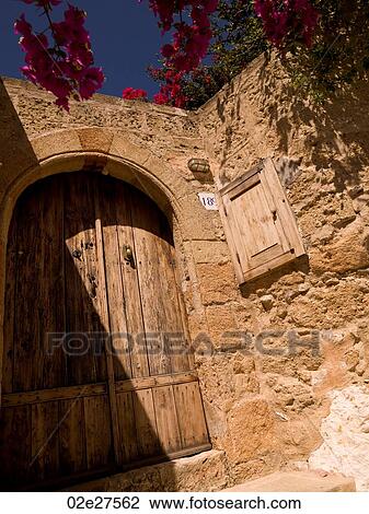 Wooden door and stone wall in Rhodes Greece View Large Photo Image Stock Image - Wooden door and stone wall in Rhodes Greece. Fotosearch