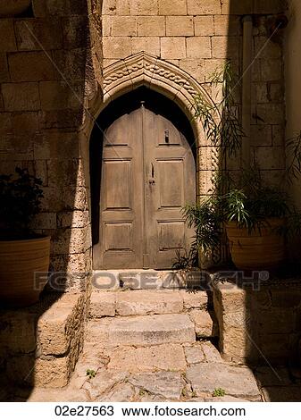 Wooden door and stone wall in Rhodes Greece View Large Photo Image Stock Image - Wooden door and stone wall in Rhodes Greece. Fotosearch