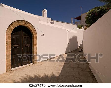 Wooden door and stone wall in Rhodes Greece View Large Photo Image Stock Image - Wooden door and stone wall in Rhodes Greece. Fotosearch