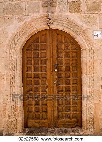 Wooden door and stone wall in Rhodes Greece View Large Photo Image Stock Photo - Wooden door and stone wall in Rhodes Greece. Fotosearch