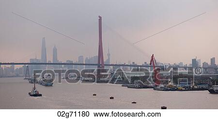 Stock Image - Yangpu Bridge across Huangpu River, Shanghai, China. Fotosearch