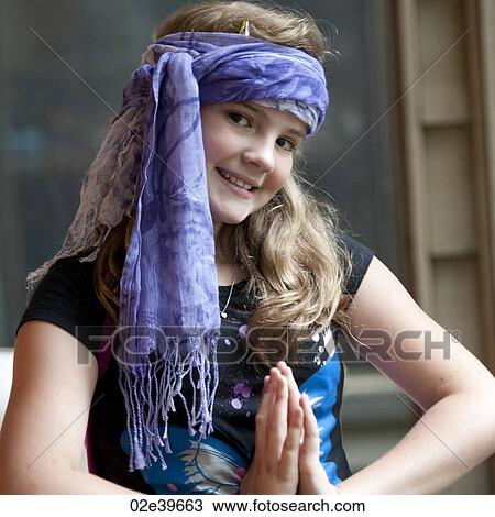 Young girl with a scarf around her head posing View Large Photo Image Stock Image - Young girl with a scarf around her head posing . Fotosearch