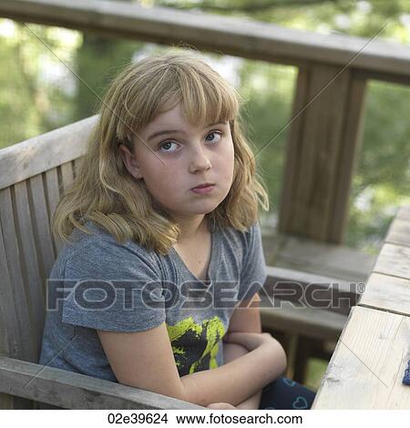 Young girl with inquiring look on her face at Lake of the Woods, Ontario View Large Photo Image Picture - Young girl with inquiring look on her face at Lake of the Woods, Ontario. Fotosearch