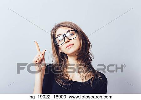 A woman shows a finger up View Large Photo Image Stock Image - A woman shows a finger up. Fotosearch