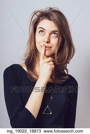 A young pensive girl looking up View Large Photo Image Stock Image - A young pensive girl looking up. Fotosearch