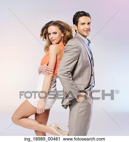 Stock Image - Adorable young couple posing together. Fotosearch