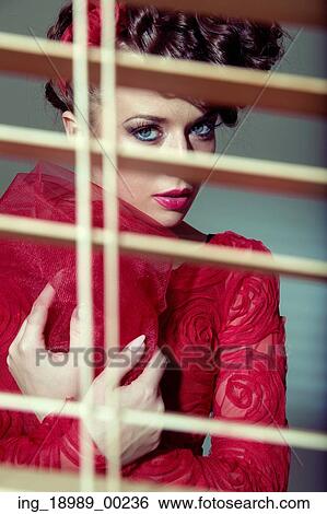 Stock Photograph - Adorable young lady with retro haircut. Fotosearch