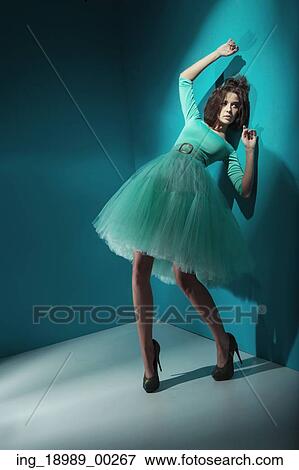 Stock Photo - Alluring woman wearing sea-green dress. Fotosearch