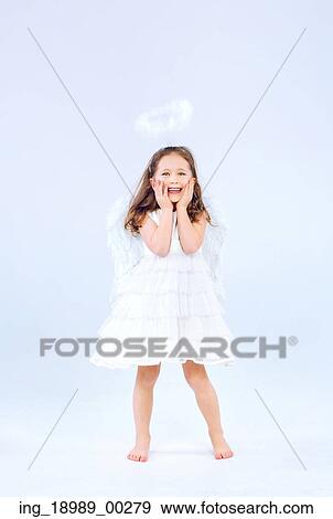 Angel child girl with pure white wings View Large Photo Image Stock Photo - Angel child girl with pure white wings. Fotosearch
