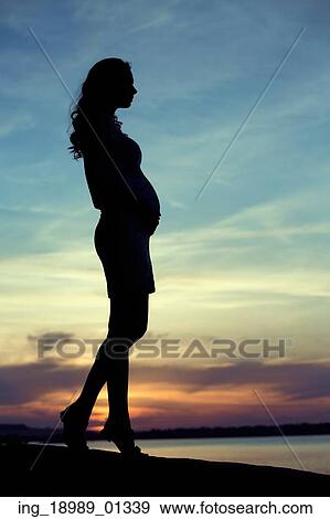 Stock Photo - Artistic photo of the woman&rsquo; s silhouette. Fotosearch