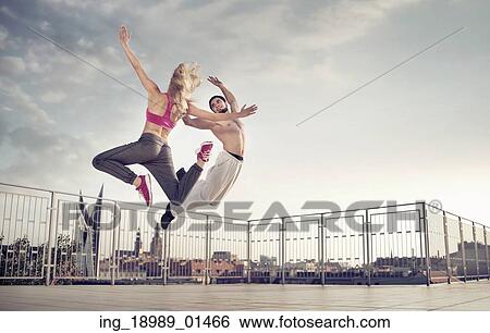 Athletic couple during the hard jump training View Large Photo Image Stock Photograph - Athletic couple during the hard jump training. Fotosearch