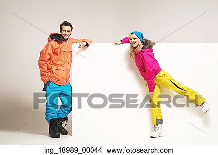 Picture - Attractive couple wearing fancy winter clothes. Fotosearch