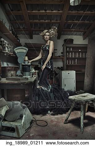 Attractive elegant lady in dirty retro room View Large Photo Image Stock Image - Attractive elegant lady in dirty retro room. Fotosearch
