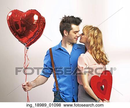 Attractive happy couple during valentine’ s day View Large Photo Image Stock Photo - Attractive happy couple during valentine’ s day. Fotosearch