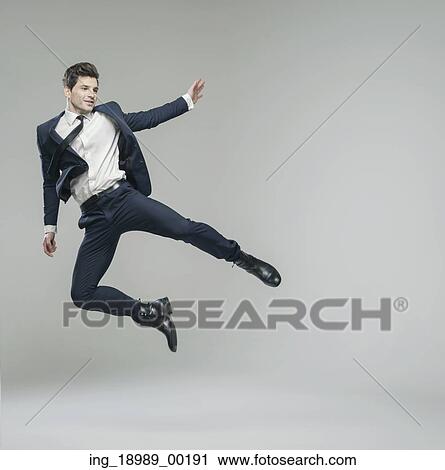 Stock Image - Attractive young guy in fancy pose. Fotosearch