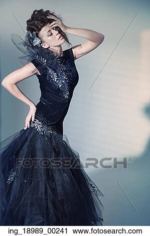 Stock Image - Beaitiful young lady in art pose. Fotosearch