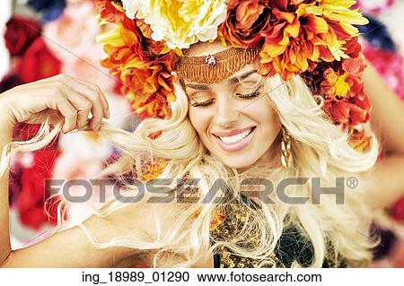 Beautiful smiling lady with a lot of flowers View Large Photo Image Stock Image - Beautiful smiling lady with a lot of flowers. Fotosearch