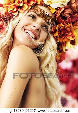 Stock Photo - Beautiful smiling woman with fine wreath. Fotosearch
