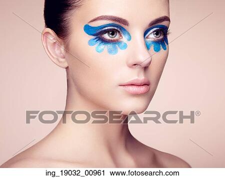 Stock Image - Beautiful woman face. Perfect makeup. Beauty fashion. Eyelashes. Cosmetic Eyeshadow. Fotosearch