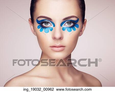 Stock Image - Beautiful woman face. Perfect makeup. Beauty fashion. Eyelashes. Cosmetic Eyeshadow. Fotosearch
