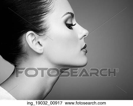 Stock Photo - Beautiful woman face. Perfect makeup. Beauty fashion. Eyelashes. Cosmetic Eyeshadow. Black and white. Fotosearch