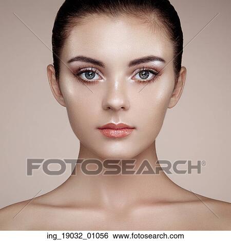 Stock Photograph - Beautiful woman face. Perfect makeup. Beauty fashion. Eyelashes. Cosmetic Eyeshadow. Highlighting. Fotosearch