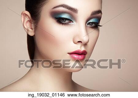 Stock Photograph - Beautiful woman face. Perfect makeup. Beauty fashion. Eyelashes. Lips. Cosmetic Eyeshadow. Fotosearch