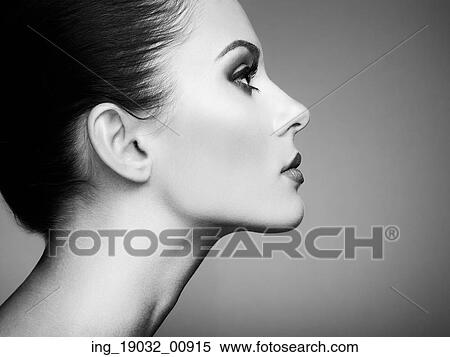 Stock Photography - Beautiful woman face. Perfect makeup. Beauty fashion. Eyelashes. Cosmetic Eyeshadow. Black and white. Fotosearch