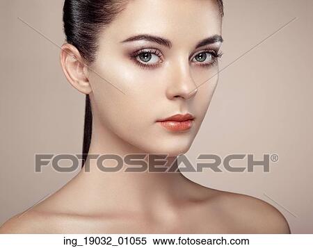 Stock Photography - Beautiful woman face. Perfect makeup. Beauty fashion. Eyelashes. Cosmetic Eyeshadow. Highlighting. Fotosearch