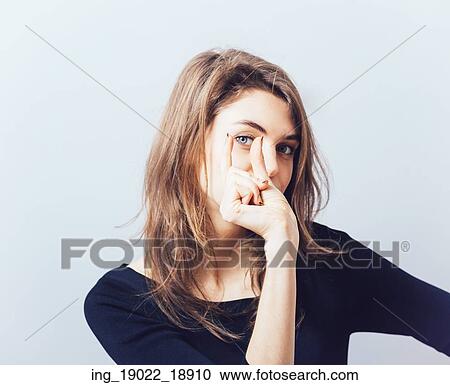 Stock Image - Beautiful woman shows small size. Fotosearch