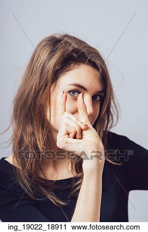 Stock Image - Beautiful woman shows small size. Fotosearch